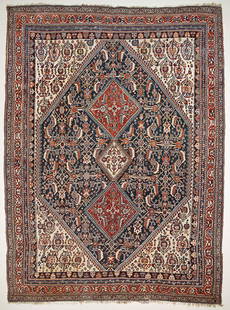 Qashqai Carpet: An early 20th century wool Qashqai carpet. Approx. 230x153cm 