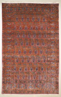 Qum Carpet: A wool repeated boteh design Qum carpet. Circa 1950. Approx. 218x140cm 