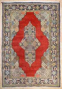 Qum Carpet: A wool Qum carpet of geometrical and medallion design on a red background. Circa 1950. &nbsp; Approx. 155x105cm &nbsp;