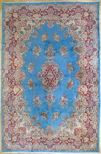 French Kerman Carpet: An early 20th century large French Kerman carpet with floral designs on turquoise background. Circa 1930. Approx. 490x300cm 