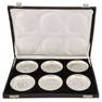 A boxed set of six Indian silver plates.