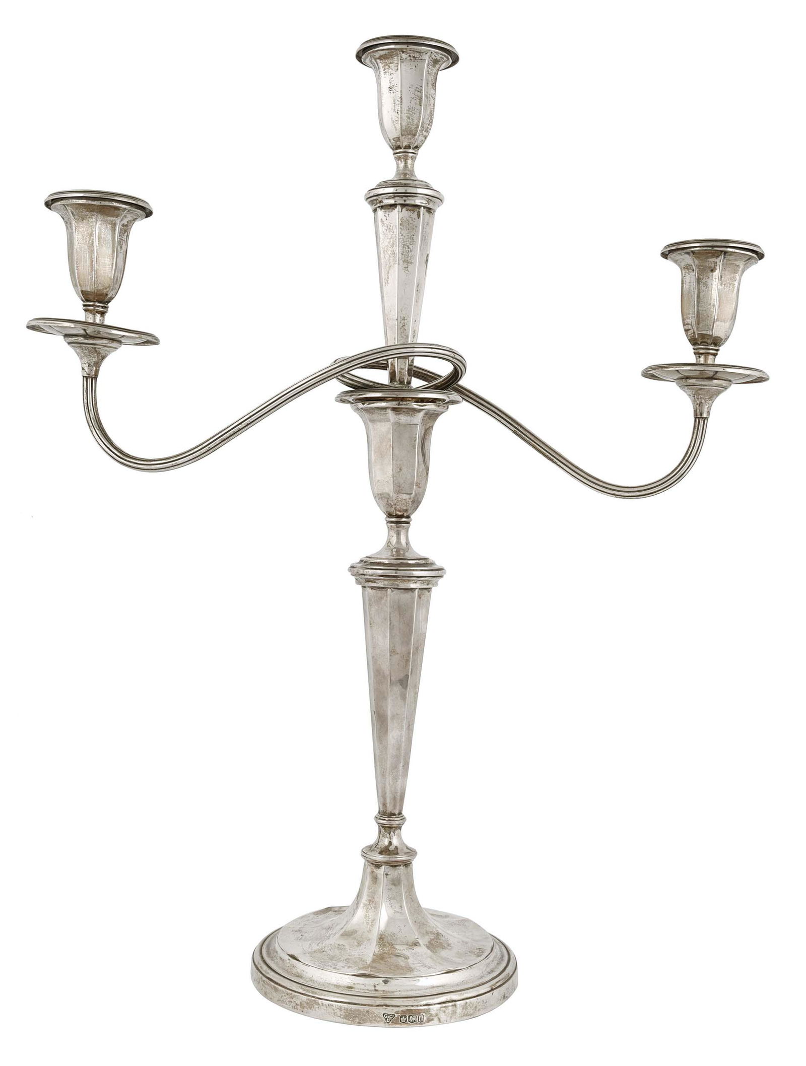 Silver candelabra. by Garrard & Co Ltd.: A silver candelabra featuring three arm cups, scrolling branches on oval tapering sticks, with hallmarks Sheffield (1953/54) by Garrard & Co Ltd., 112 Regent Street, London. W. Approx. W: 1,786