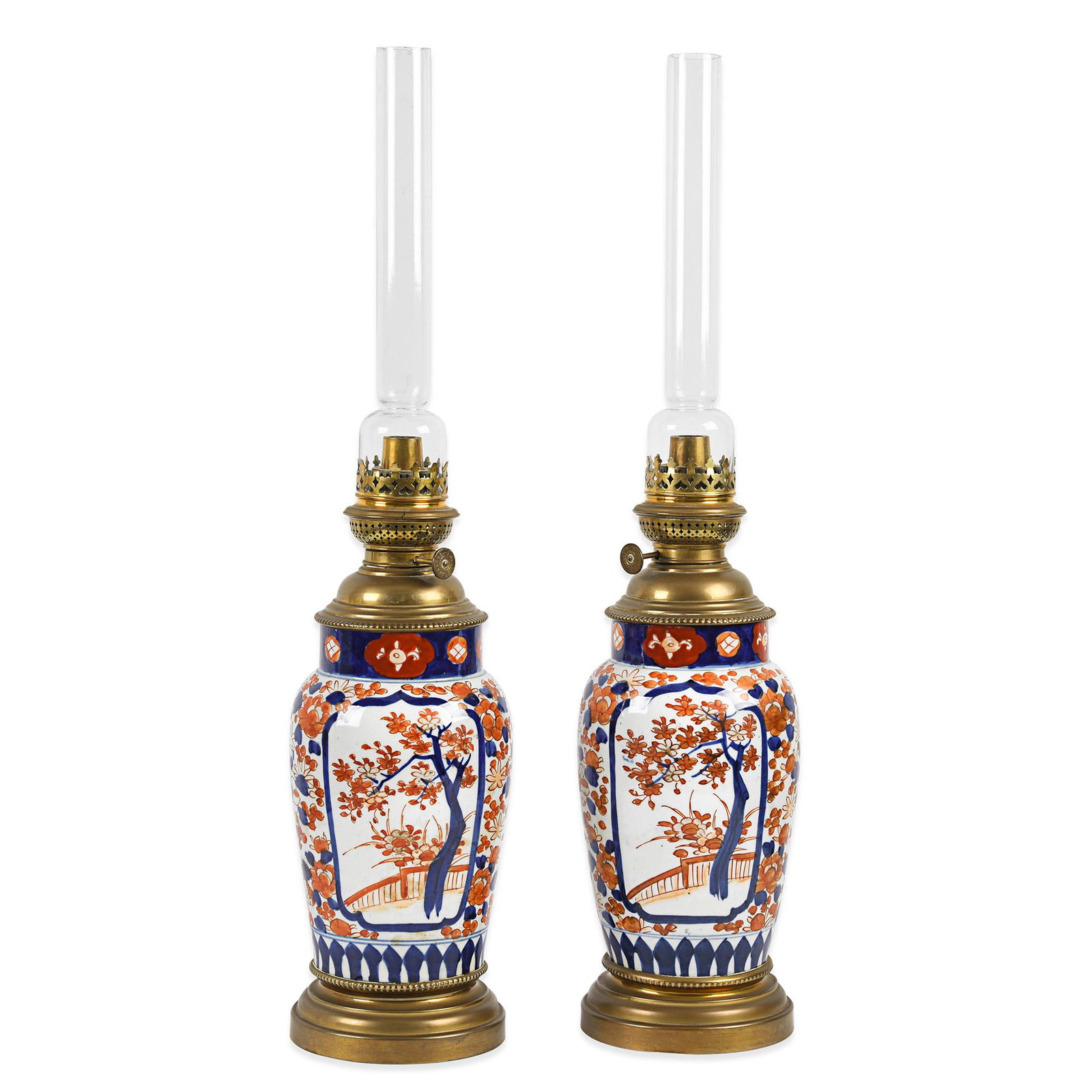 A pair of late 19th century Imari porcelain oil lamps.: A pair of late 19th century Imari porcelain oil lamps. Approx. H:60cm 