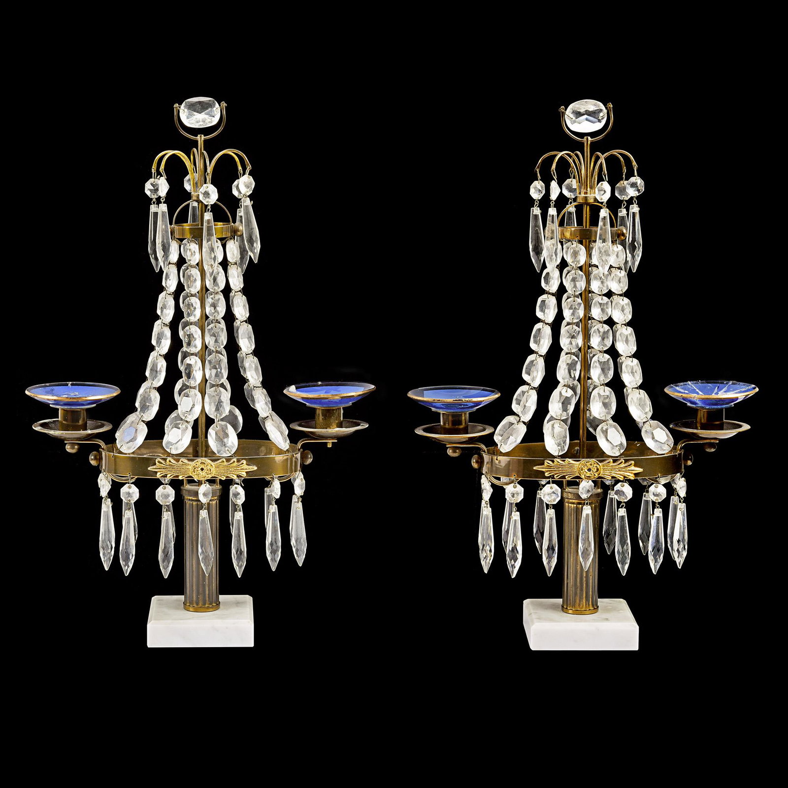 A pair of two arm crystal girandoles.: A pair of early 20th century European two arm crystal and cobalt blue glass girandoles. Approx. H: 40cm Condition: One of the girandoles repaired.