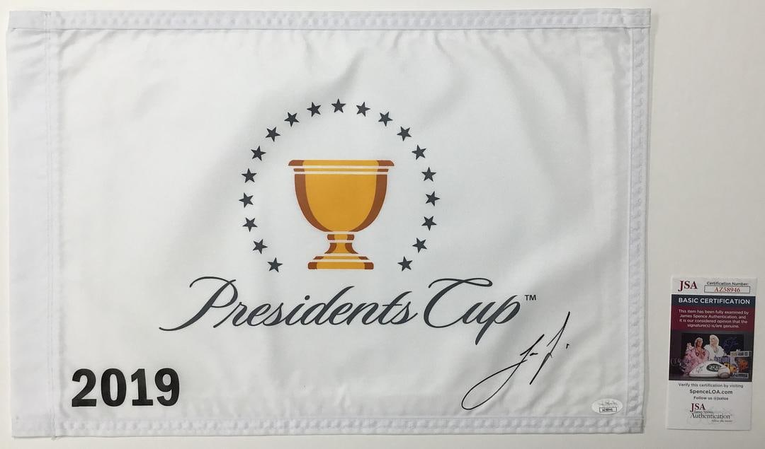 Joaquin Niemann The President's Cup 2019 Signed Pin Flag - JSA #AZ58946: Joaquin NiemannThe President's Cup 2019 Pin FlagAuthenticated by JSA Product Details:Official The President's Cup 2019 pin flag signed perfectly by PGA star Joaquin Niemann. The signature is authentic