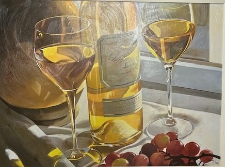 Thomas Stiltz — Gold in the Afternoon: A sunlit white wine bottle, glasses, and grapes rendered in Stiltz’s crisp photographic realism Stiltz combines his photography background with fine art technique to produce luminous,