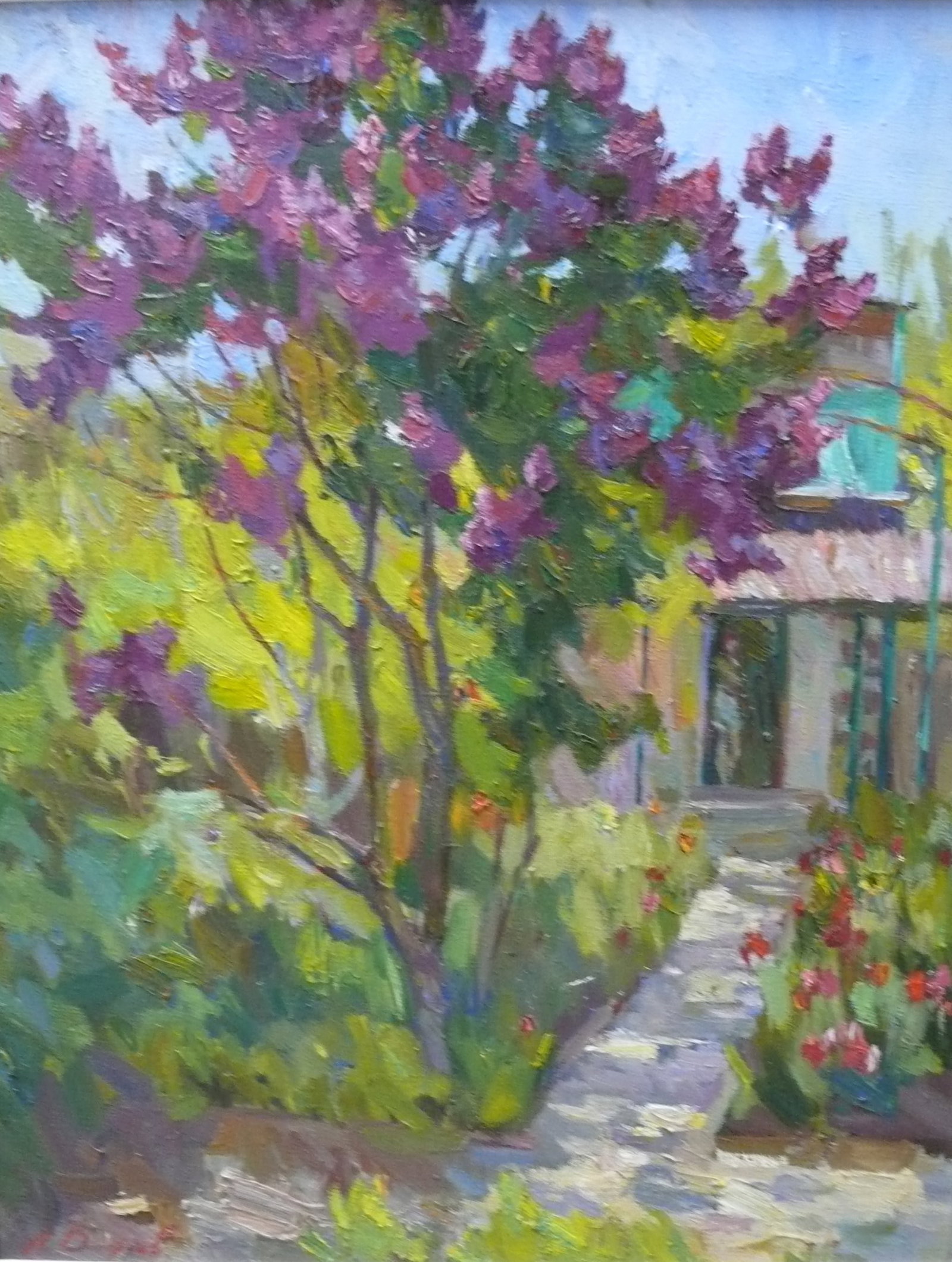 Oleksiy (Alexei) Dmitriyev — Lilac by the Garden Path: A sunny, lush front garden with a tree adorned in purple flowers, positioned before a quaint house with a winding path. Impressionistic brushwork captures the warmth of the scene and the vibrancy of n