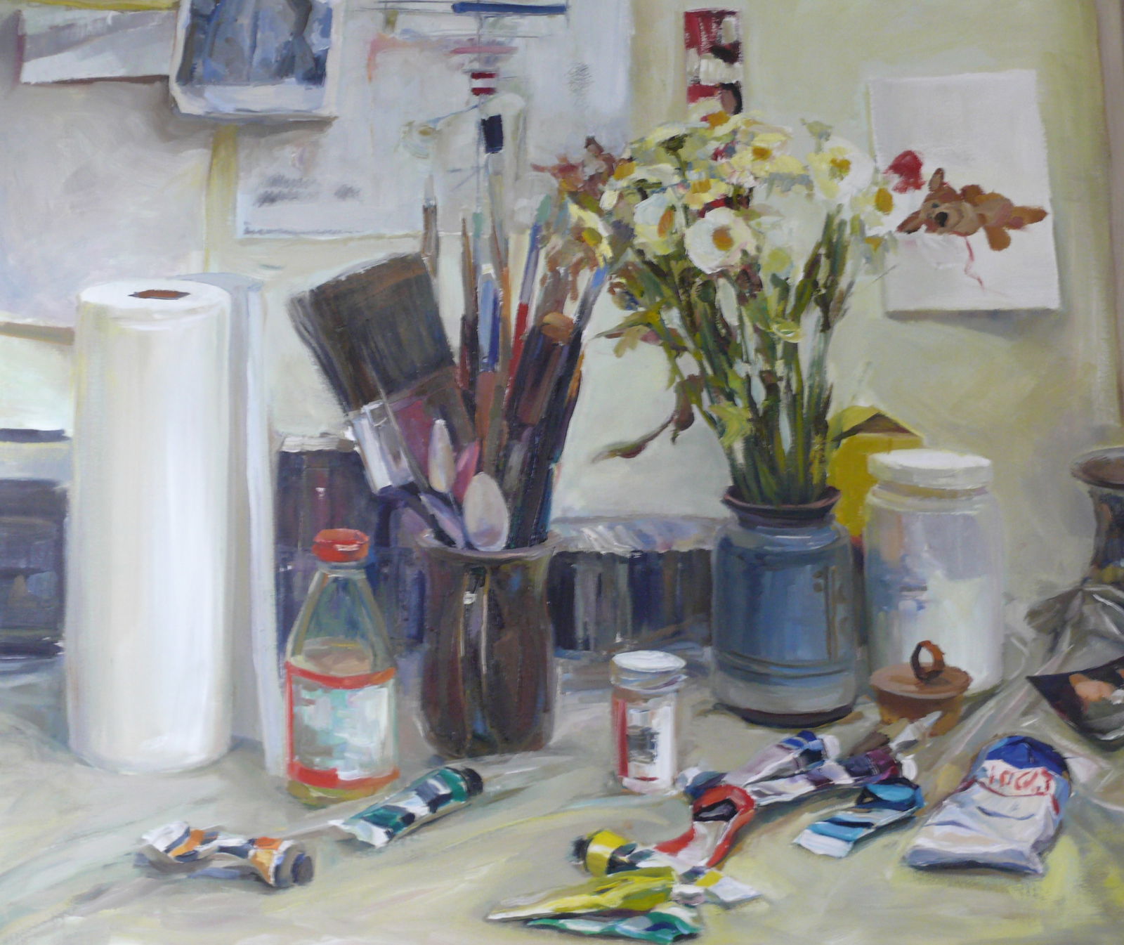 Tatiana Ivaschenco Jackson — Artist’s Table with Daisies: Still life of an artist’s workstation featuring fresh daisies and scattered painting supplies. Warm, inviting palette with expressive brushwork highlighting textures of flowers, canvas, and tools Ta