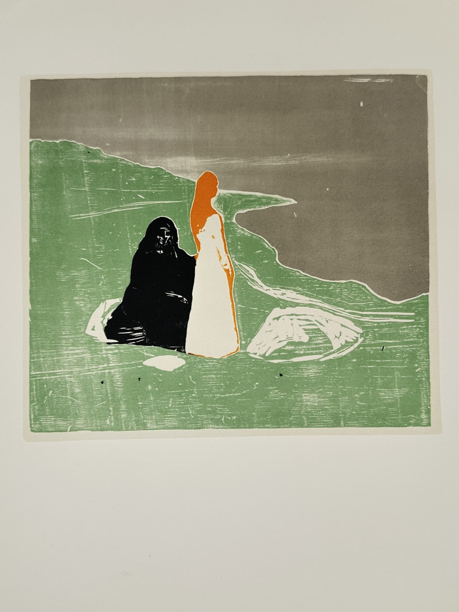 Edvard Munch (1863–1944), after – Two Figures on the Shore – Offset print (1980): This offset print, derived from a color woodcut, depicts two highly stylized figures standing on a grassy shoreline overlooking a dark sea. One figure is rendered completely in black, seated or crouch
