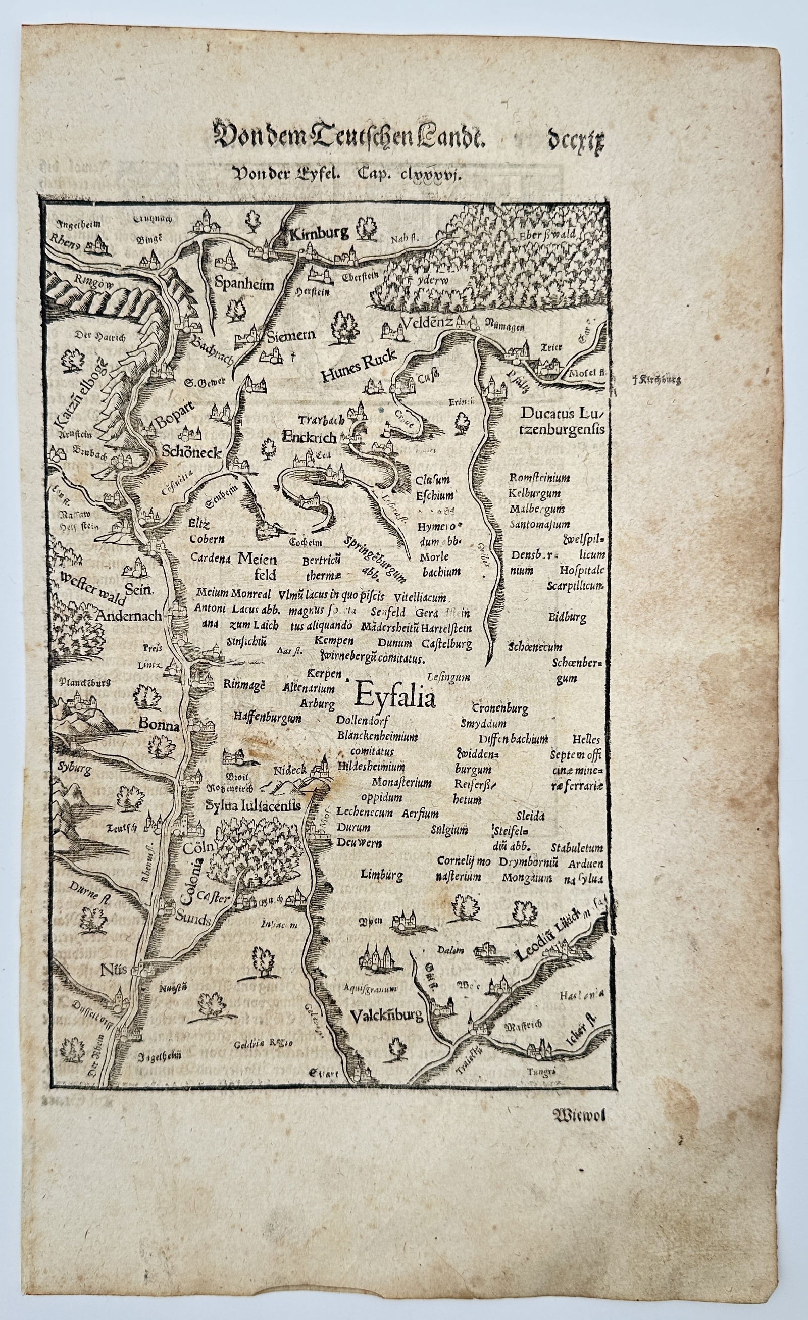 Sebastian Münster (1488–1552) – View of the Eifel region – Woodcut (1550): Von der Eyfel. This print presents a detailed regional map of the Eifel territory in western Germany, situated between the Rhine, Moselle, and Ahr rivers. The composition illustrates the rugged topogr