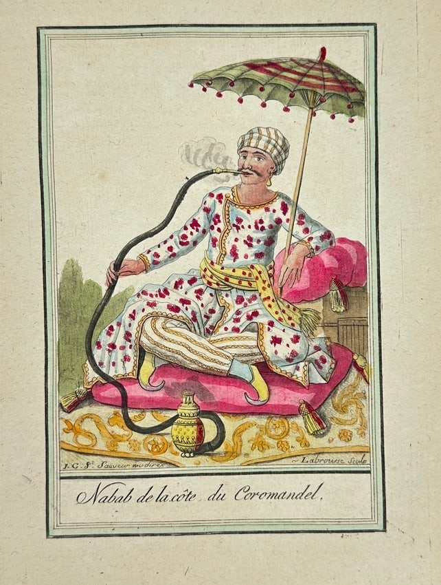 Jacques Grasset de Saint-Sauveur – Nabab from the Coromandel Coast – Engraving: This finely hand-colored engraving depicts a Nabab de la côte du Coromandel (Nawab of the Coromandel Coast), seated on an ornate carpet while smoking a long-stemmed hookah under a decorative parasol.