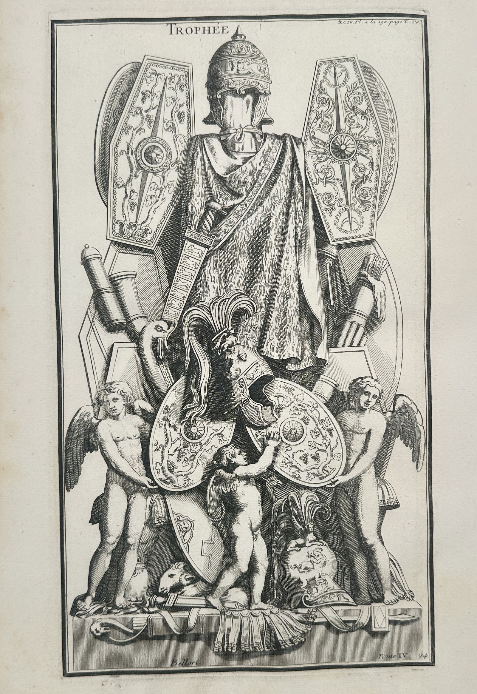 Bernard de Montfaucon (1655–1741) – Trophée of Classical Arms – Engraving (1719): "TROPHÉE" presents a decorative arrangement of ancient military equipment, known as a trophy, which was a common motif in classical art to commemorate victory. The central focus is a suit of muscle c