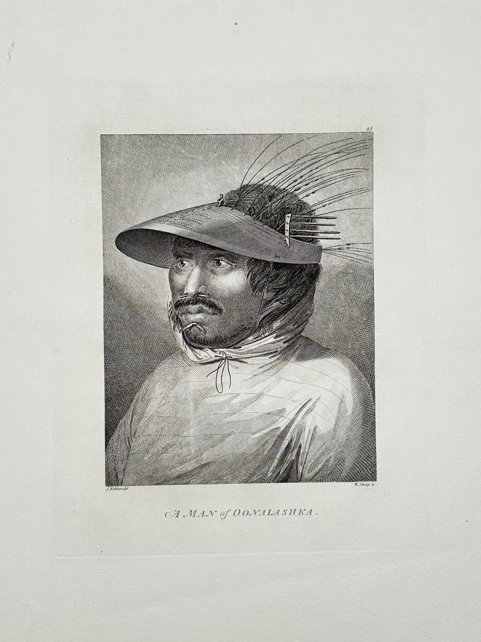 John Webber (1751-1793) – Portrait of a Man of Oonalashka – Copper engraving (1784): "A Man of Oonalashka" depicts an Aleut man from Unalaska Island wearing a traditional wooden hunting visor ornamented with sea lion whiskers. This copper engraving is from the official account of Capt