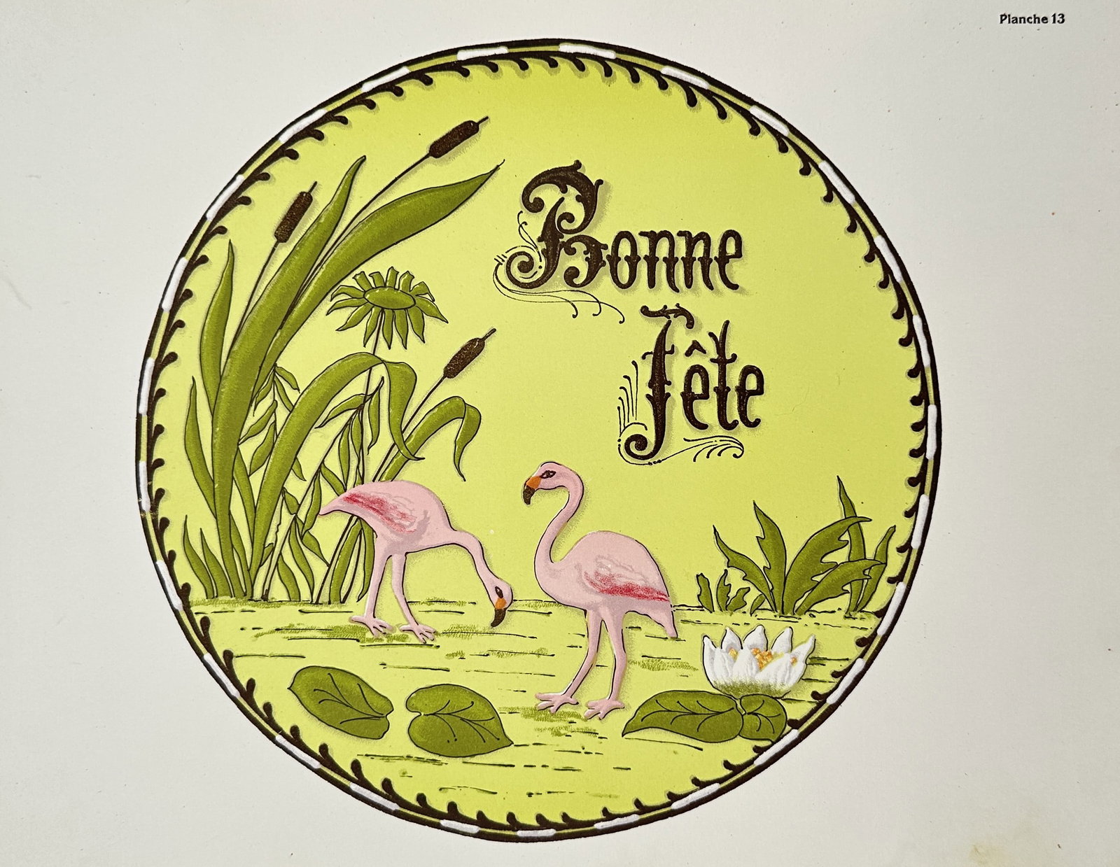 Thérèse de Dillmont (1846–1890), after – Bonne Fête – Offset print (20th Century): "Bonne Fête." This decorative print, identified as Planche 13, features a circular composition with pink flamingos, water lilies, and reeds, centered around a festive greeting. The work is a mid-twen