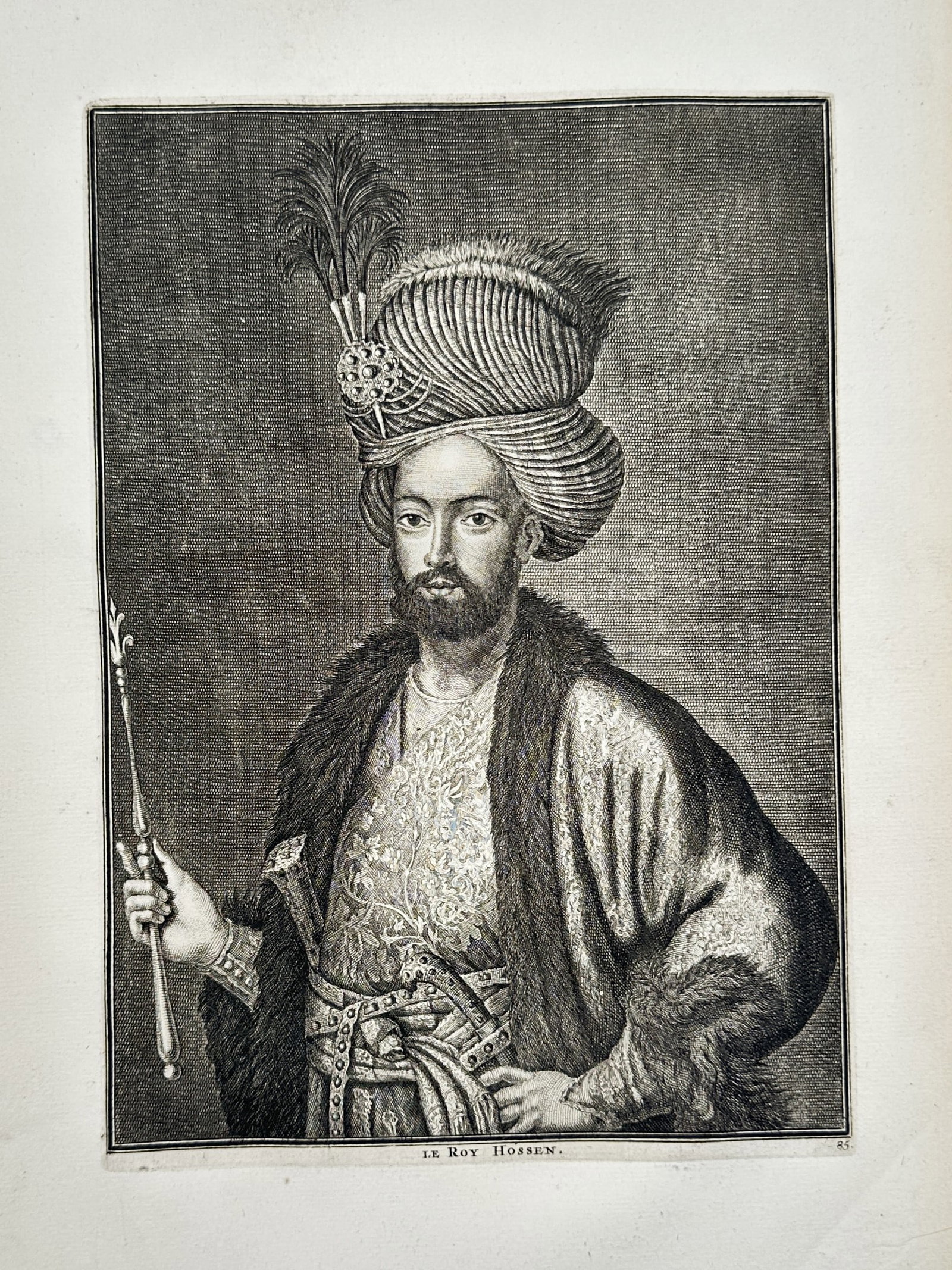 Cornelis de Bruyn – Portrait of Shah Sultan Hossein – Engraving (1711): "Le Roy Hossen" features a half-length portrait of the Safavid monarch oriented slightly to the left against a densely hatched neutral background. The figure is depicted wearing a luxurious fur-collar