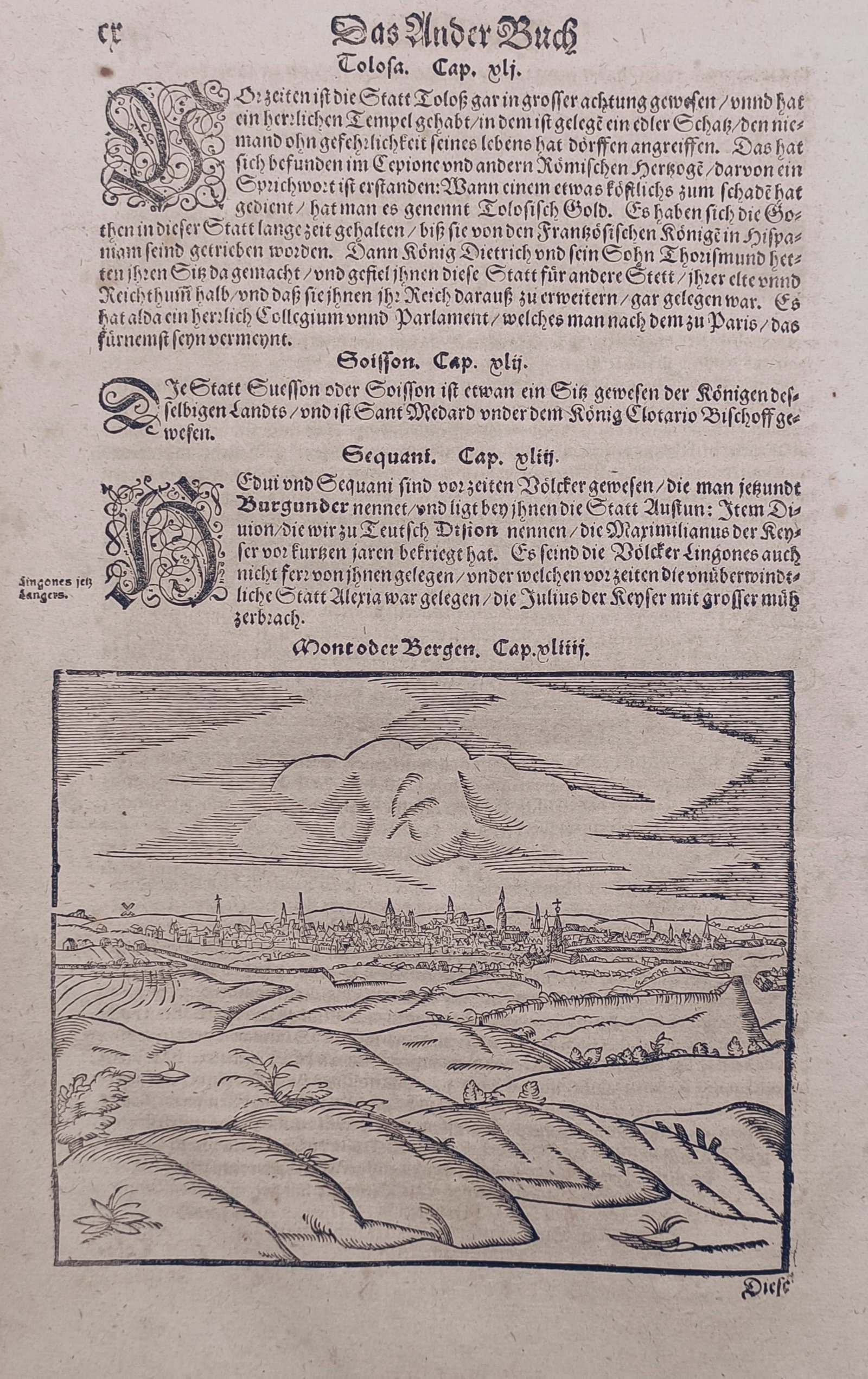 Sebastian Münster (1488–1552) – View of Mons – Woodcut (1643): "Mons oder Bergen" illustrates a panoramic topographical view of the city of Mons set across a rolling landscape of fields, hills, and paths, with the town's dense collection of buildings, spires, and