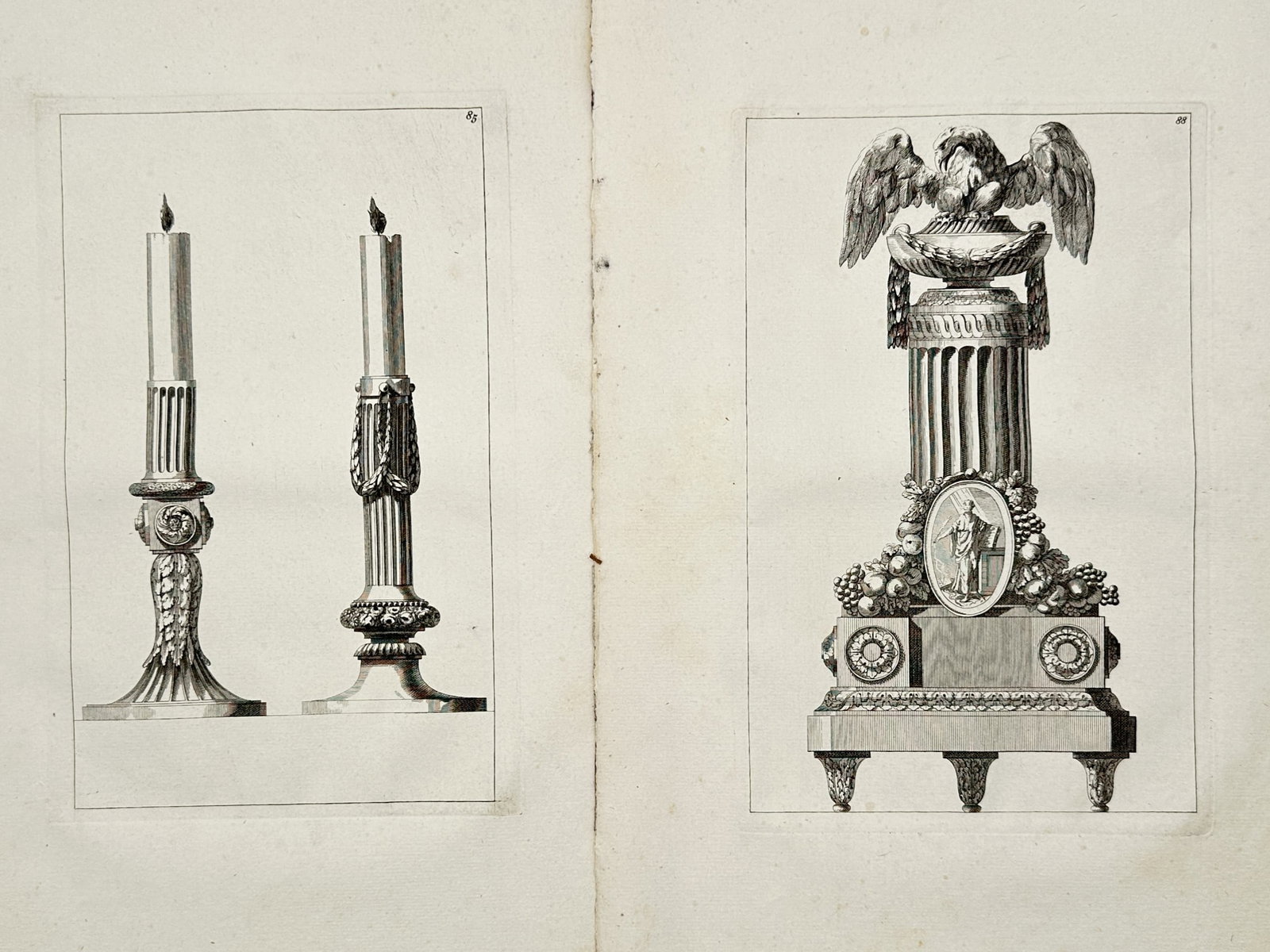Jean-Charles Delafosse – Set of 2: Studies of Classical Candlesticks and Pedestals – Engravings: "Studies of Classical Candlesticks and Pedestals" depicts highly ornate neoclassical designs for decorative interior objects, showcasing a pair of fluted candlesticks with draped garlands alongside a 