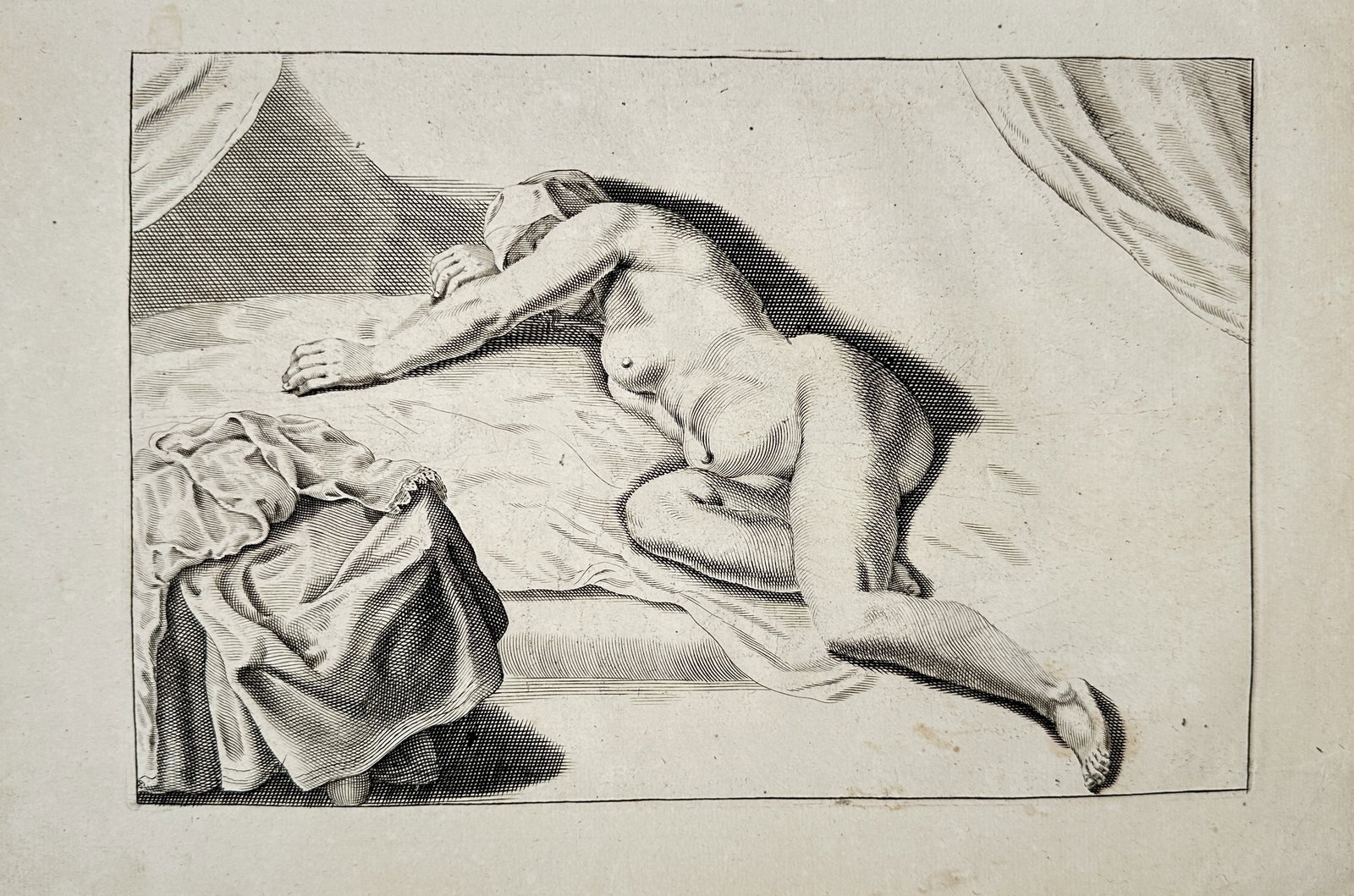 Frederick de Wit – Reclining Nude Female Study – Engraving (17th Century): "Reclining Nude Female Study" presents an anatomical life study depicting a reclining female figure resting upon a draped bed within an interior setting. Published in the Netherlands during the sevent