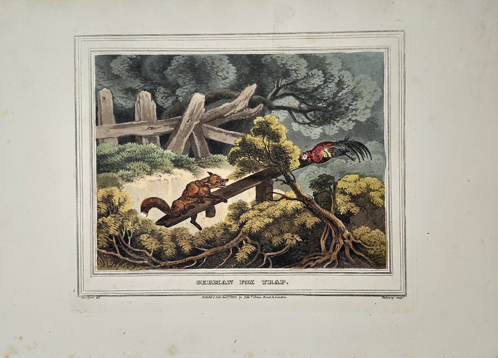 Franz Joseph Manskirch – German Fox Trap – Aquatint (1813): "German Fox Trap" This landscape scene illustrates a rustic wooden seesaw trap mechanism situated along a brush-covered hillside backed by a weathered post fence. The composition captures a wild red f
