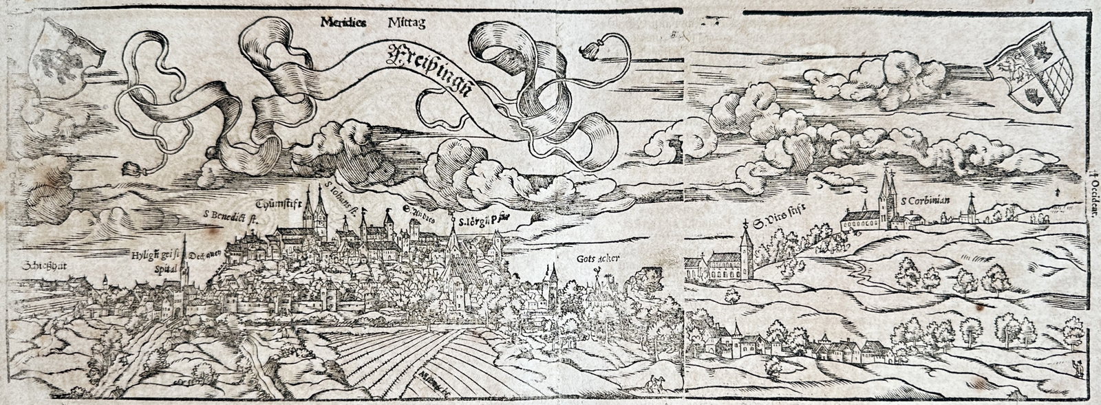 Sebastian Münster – The Episcopal City of Freising in Bavaria – Woodcut (16th Century): "The Episcopal City of Freising in Bavaria" presents an expansive panoramic cityscape showcasing the cathedral hill, monastic complexes, church spires, and fortified settlements surrounded by rolling 