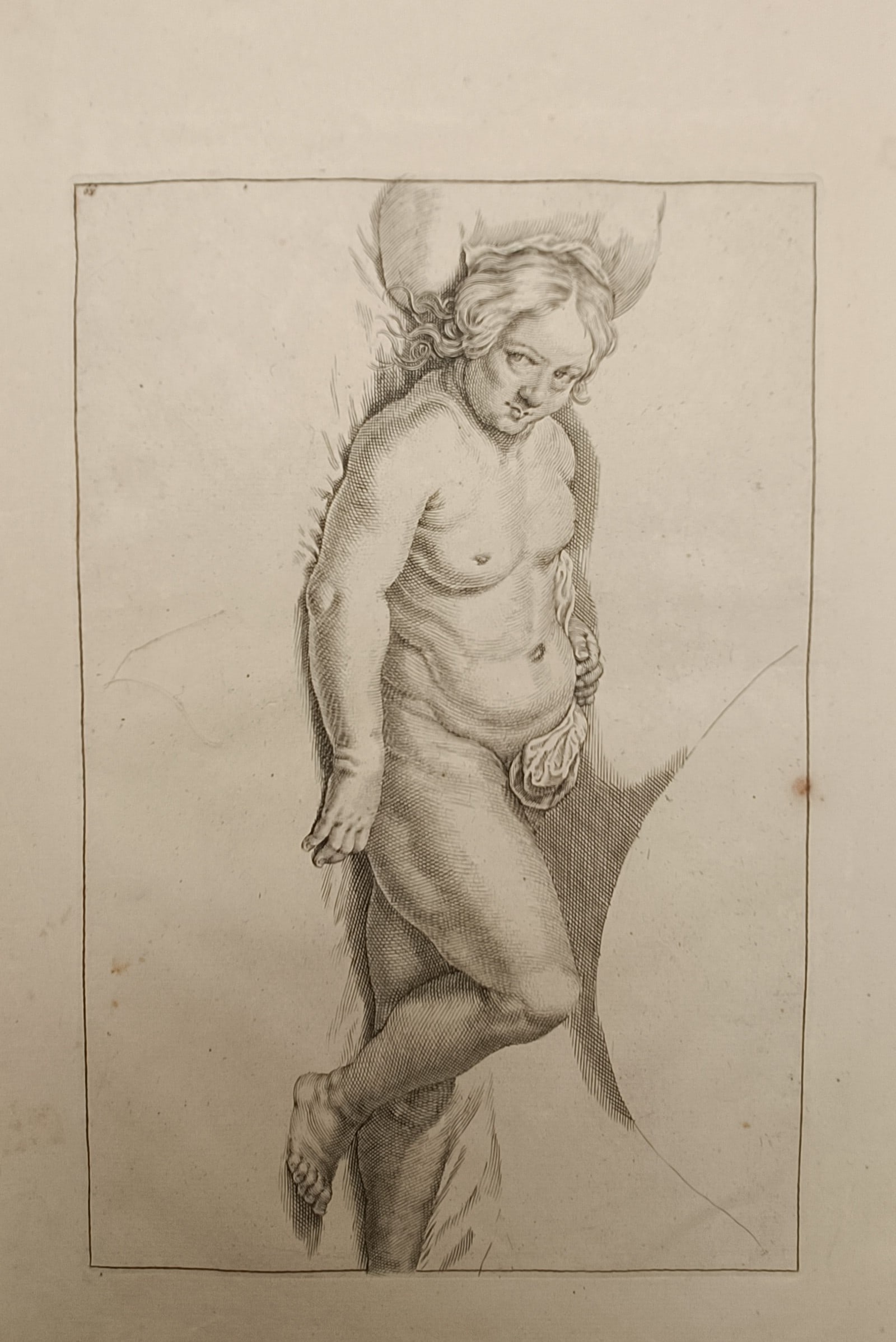 Frederik de Wit – Academic Study of a Reclining Male Figure – Engraving (17th Century): "Academic Study of a Reclining Male Figure" depicts a classical anatomical study of a recumbent male nude presented in dynamic foreshortening, showcasing precise cross-hatching, muscular contours, and