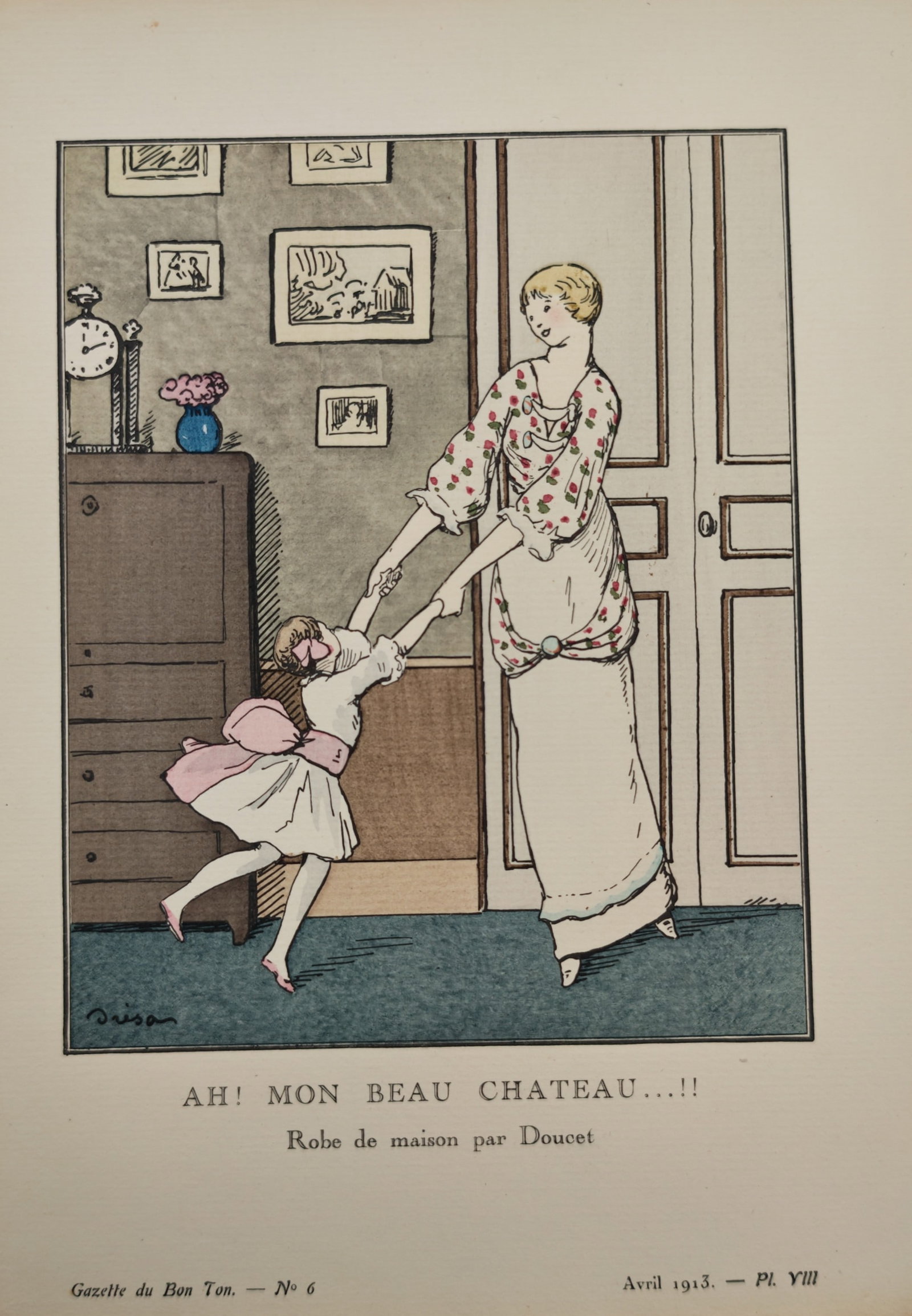 Jacques Dresa – House Dress by Doucet – Pochoir Print (1913): "Ah! Mon Beau Chateau...!!" This fashion print presents a domestic indoor scene depicting a woman clad in a patterned floral house dress playfully swinging a young girl by the hands near a doorway and