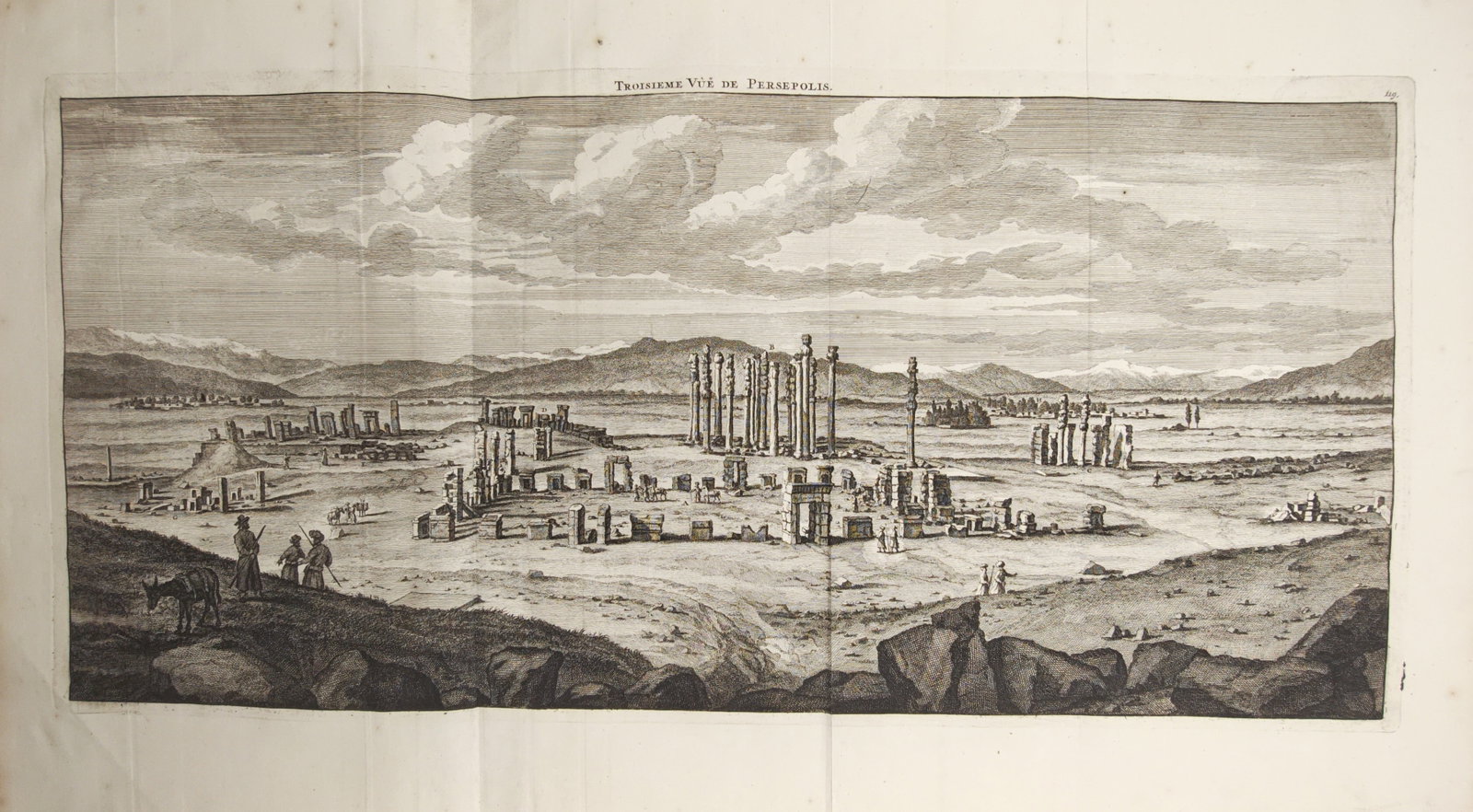 Cornelis de Bruyn – Third View of Persepolis – Engraving (1718): "Third View of Persepolis" presents an extensive panoramic landscape capturing the ancient monumental ruins, standing columns, and stone portals of Persepolis set against distant mountains with travel