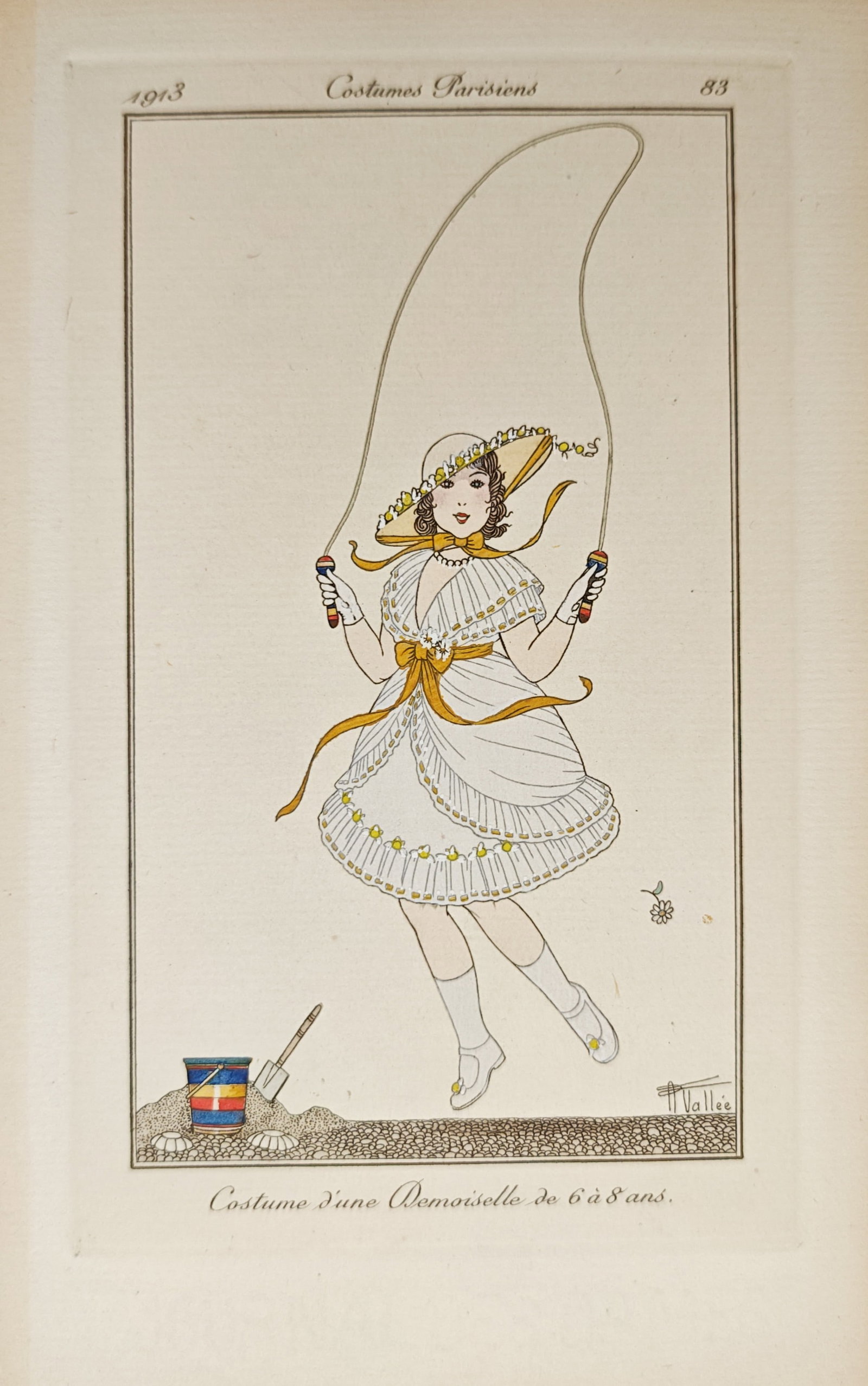 Armand Vallée – Costume of a Young Girl from 6 to 8 Years Old – Pochoir (1913): "Costume of a Young Girl from 6 to 8 Years Old" presents an early twentieth-century fashion illustration depicting a young girl in an ornate white dress skipping rope beside beach playthings. The poch