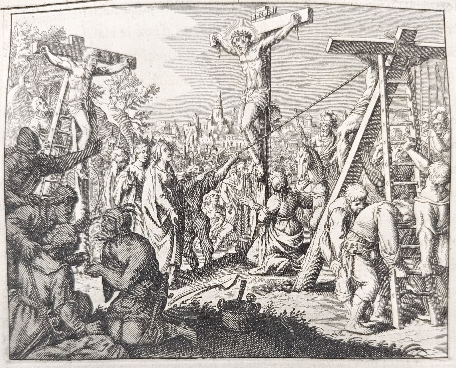 Nicolas Fontaine – The Crucifixion of Jesus Christ – Engraving (18th Century): "The Crucifixion of Jesus Christ" illustrates Christ on the cross at Golgotha flanked by the two thieves, showing Roman soldiers casting lots and mourners gathered in anguish before the distant walls 