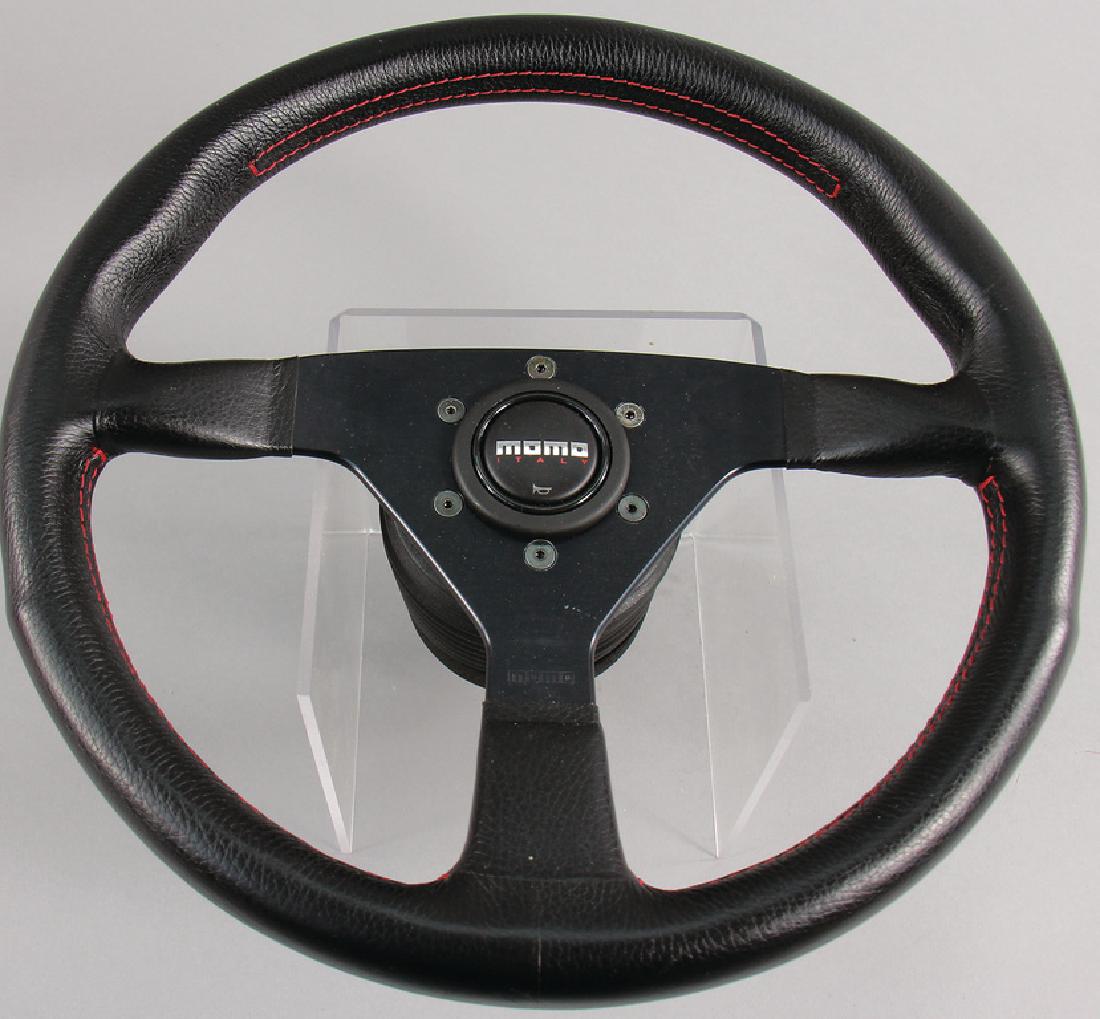 PORSCHE/MOMO Leather steering wheel for G-models AB: PORSCHE/MOMO Leather steering wheel for G-models AB 1974, with extended Porsche hub, with a diameter of 36 cm, on the back stamped 1994, NOS, with storage traces, German Description PORSCHE/MOMO Leder