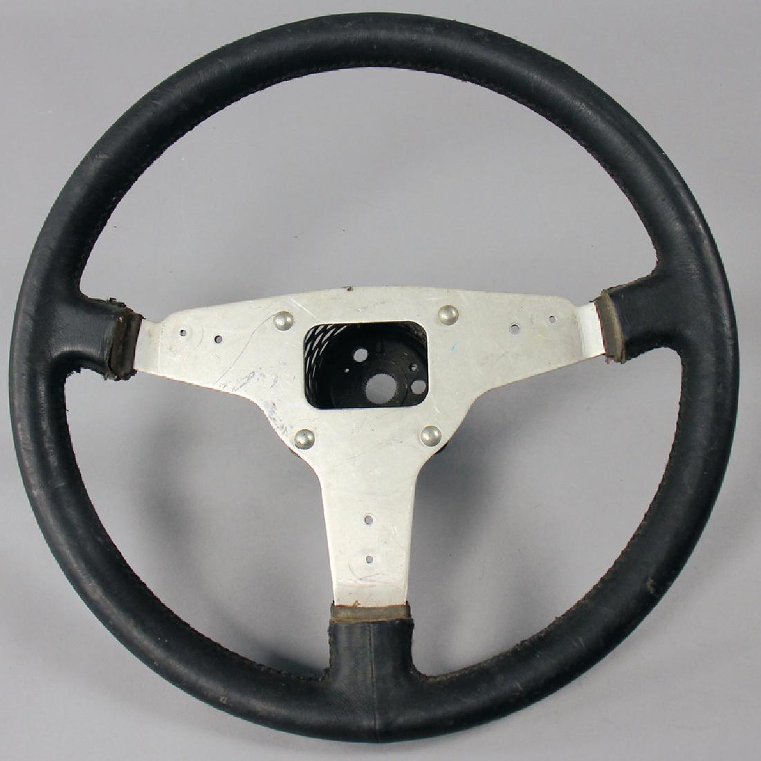 PORSCHE Steering wheel from test-resp. prototype: PORSCHE Steering wheel from test-resp. prototype division of Porsche in Weissach with different drillings, probably for G-model, with a diameter of c. 38 cm, very slightly, rare German Description POR