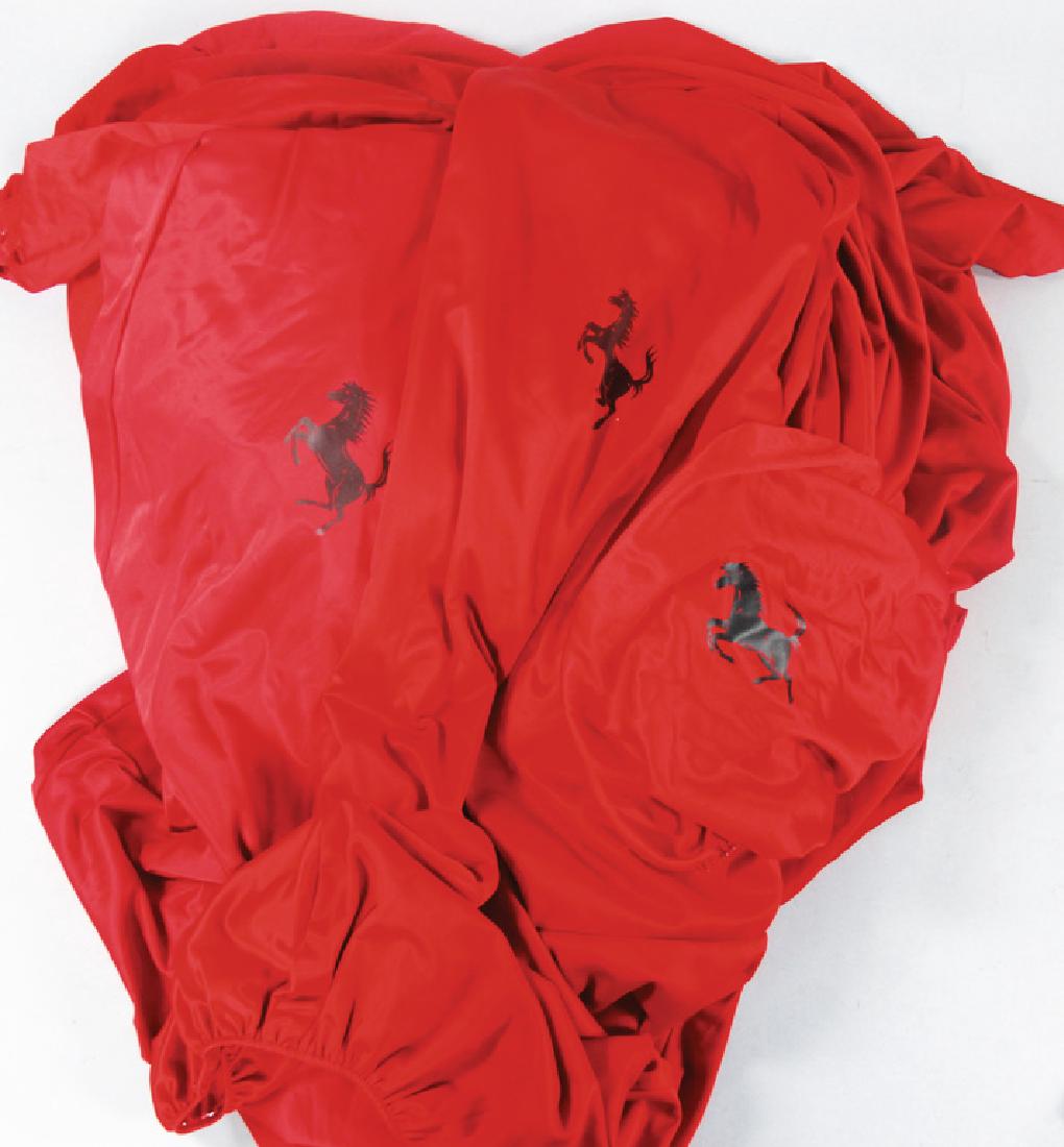 FERRARI Mixed lot with 4 pieces, consist s of a car: FERRARI Mixed lot with 4 pieces, consist s of a car cover, seat covers and also steering wheel cover for Ferrari F430 Spider, original, all in good condition German Description FERRARI, Konv. 4tlg., b