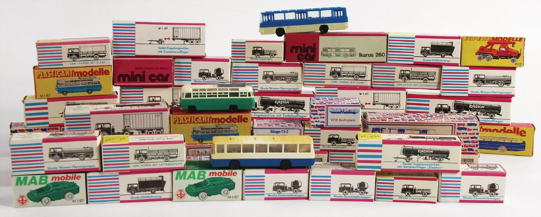 VEB/PERMOT/PLASTICART/MINICAR/MAB MOBILE big mixed lot: VEB/PERMOT/PLASTICART/MINICAR/MAB MOBILE big mixed lot with 58 pieces, model cars, among it Skoda sprinkler truck, Skoda truck with tarpaulin, bus Ikarus 66, Ikarus 200, with some trailer etc., all in