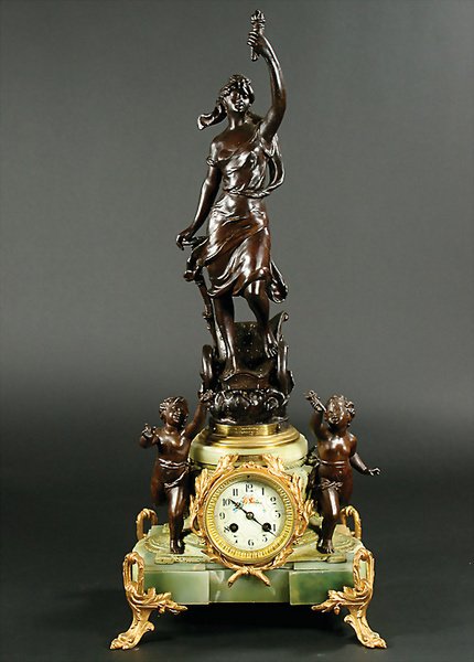 clock for fireplace, tin coated with bronze, 72 c: English Description: clock for fireplace, tin coated with bronze, 72 cm, woman standing on a car, leaning on the steering wheel, marble base with gold applications and 2 childish figures, enameled cl