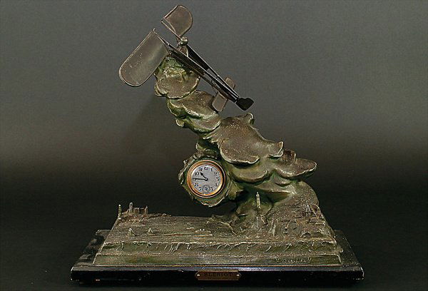 X. RAPHANEL, clock for fireplace, with plane moti: English Description: X. RAPHANEL, clock for fireplace, with plane motif, tin coated with bronze, with engraving on the board "Bleriot 25. Juillet 1909", 42 by 21 by 36 cm Deutsche Beschreibung: X. R