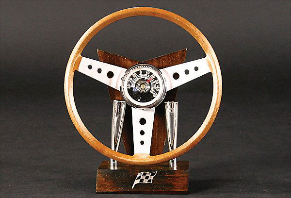 desk set, steering wheel on a wood base with 2 ha: desk set, steering wheel on a wood base with 2 handles for ballpoint and fountain pen, (19 cm tall), in original cardboard, c. '60s/'70s German Description: Schreibtischset, Lenkrad auf Holzsockel mit