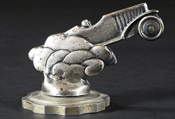 D 1924, radiator mascot "Race of Solitude", the f: D 1924, radiator mascot "Race of Solitude", the figure is a tribute to Otto Merz after his record drive at the Solitude mountain race, Mercedes-Benz Kompressor, (12 cm long), very rare, (you can find 
