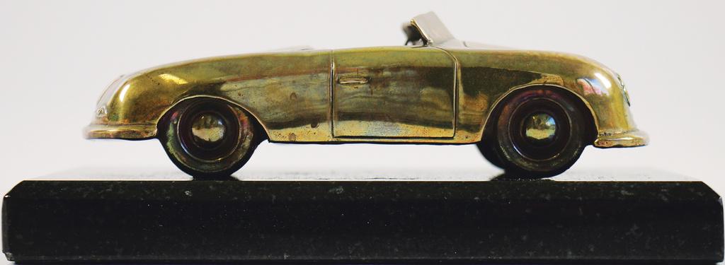 PORSCHE bronze sculpture on a granite base, "Porsche (1 of 4)