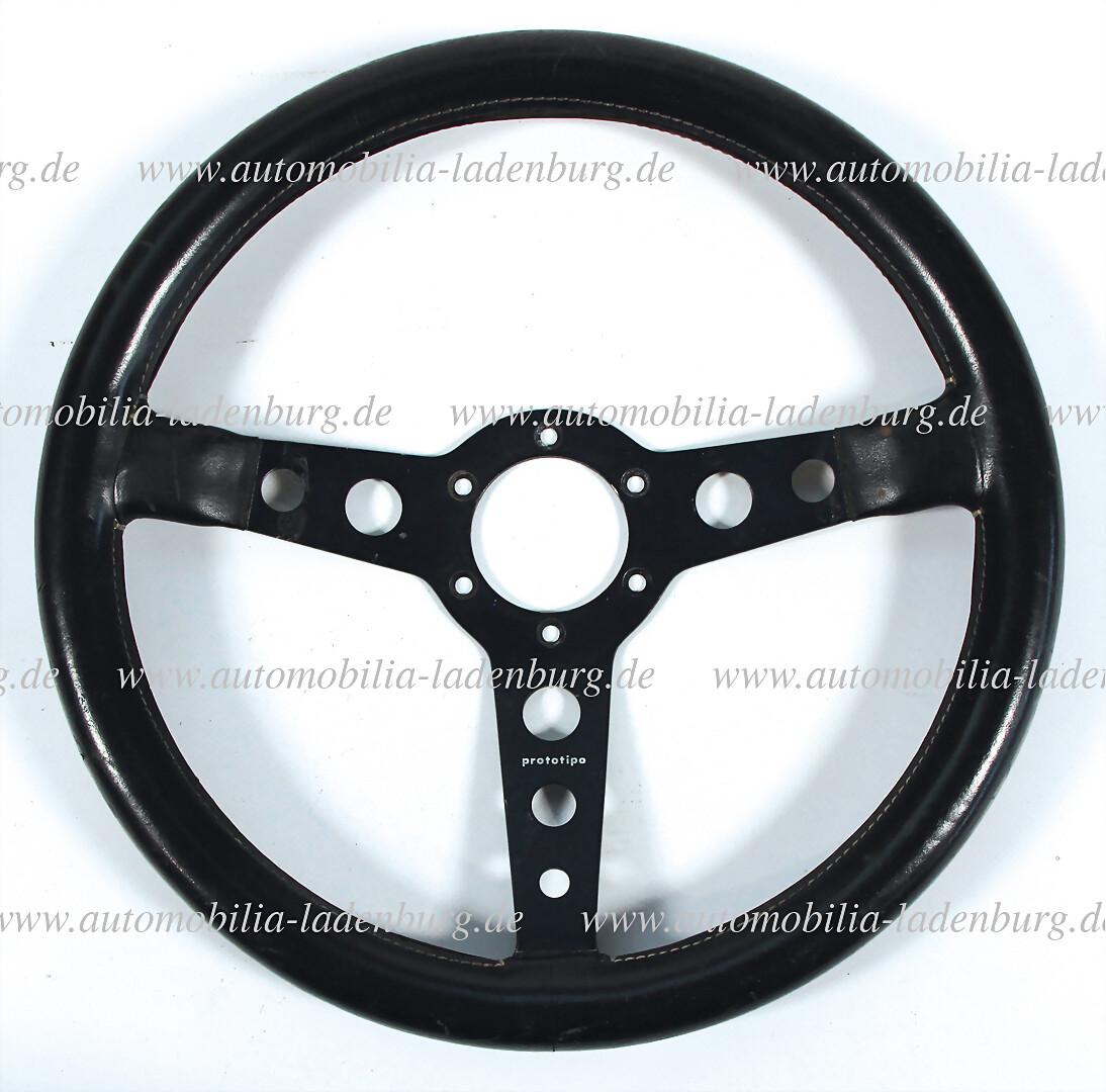 PORSCHE racing steering wheel Momo Prototipo, with traces of usage, the leather sheathing should be: PORSCHE racing steering wheel Momo Prototipo, with traces of usage, the leather sheathing should be retouched German Description PORSCHE Rennsportlenkrad Momo Prototipo, mit Gebrauchsspuren, Lederumma