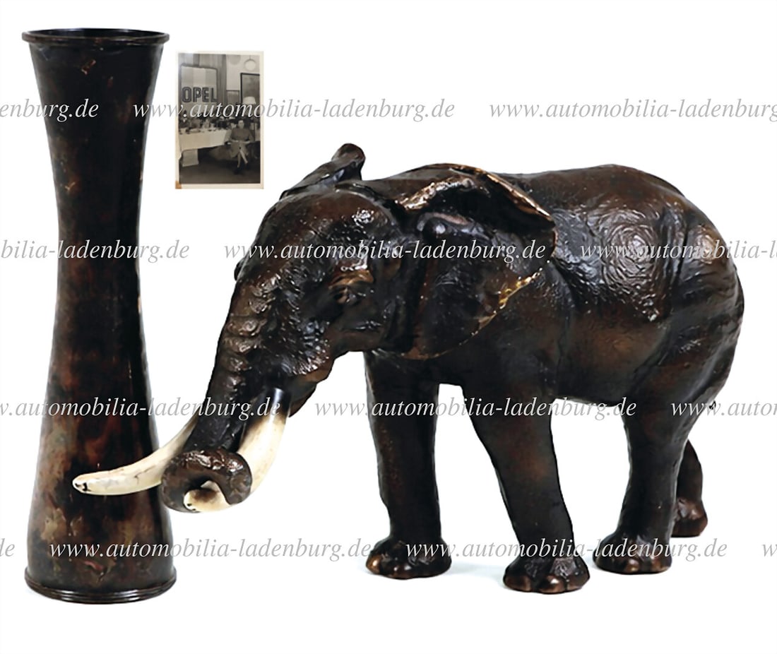 OPEL Mixed lot of 3 pieces, including bronze elephant figurine (engraved Christmas 1961 on the: OPEL Mixed lot of 3 pieces, including bronze elephant figurine (engraved Christmas 1961 on the bottom and facsimile signature Georg von Opel) 19.5x33x11.5cm, silver vase (engraved Christmas 1964 on th