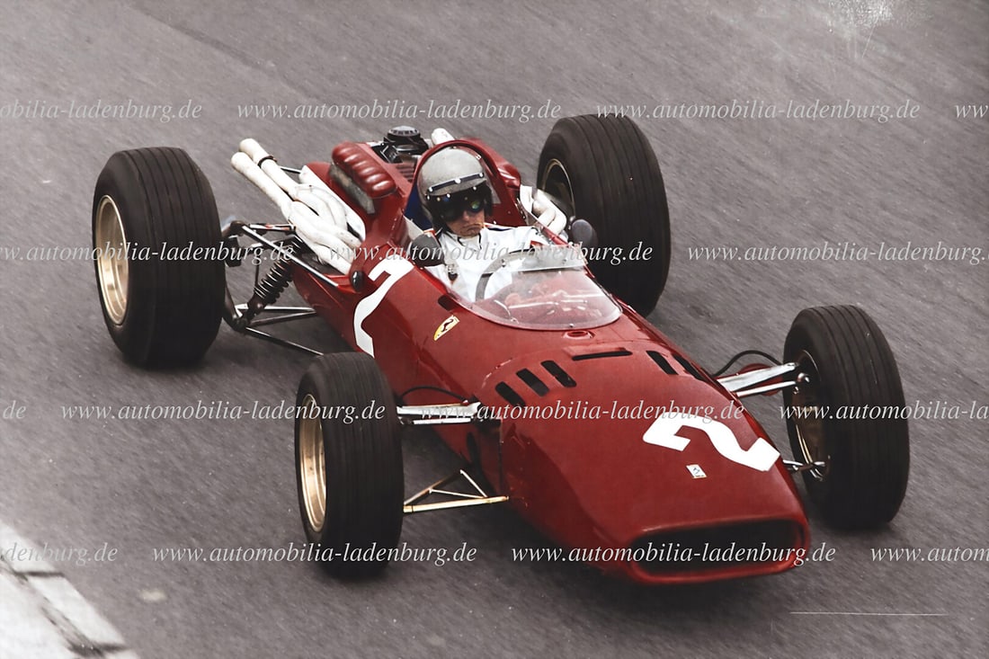 FERRARI Original color photograph Lorenzo Bandini on Ferrari 312, GP Monaco 1966, 13x18cm, stamped: FERRARI Original color photograph Lorenzo Bandini on Ferrari 312, GP Monaco 1966, 13x18cm, stamped "Attualfoto" German Description FERRARI Original Farbaufnahme Lorenzo Bandini auf Ferrari 312, GP Mon