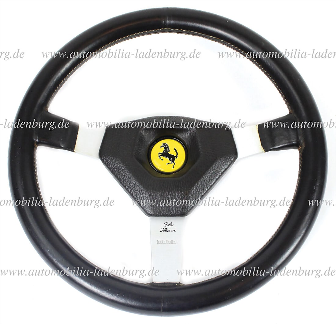 FERRARI 1981, Momo sports steering wheel "Gilles Villeneuve", with Ferrari horn button, good: FERRARI 1981, Momo sports steering wheel "Gilles Villeneuve", with Ferrari horn button, good condition German Description FERRARI 1981, Momo Sportlenkrad "Gilles Villeneuve", mit Ferrari Huptaste, gut