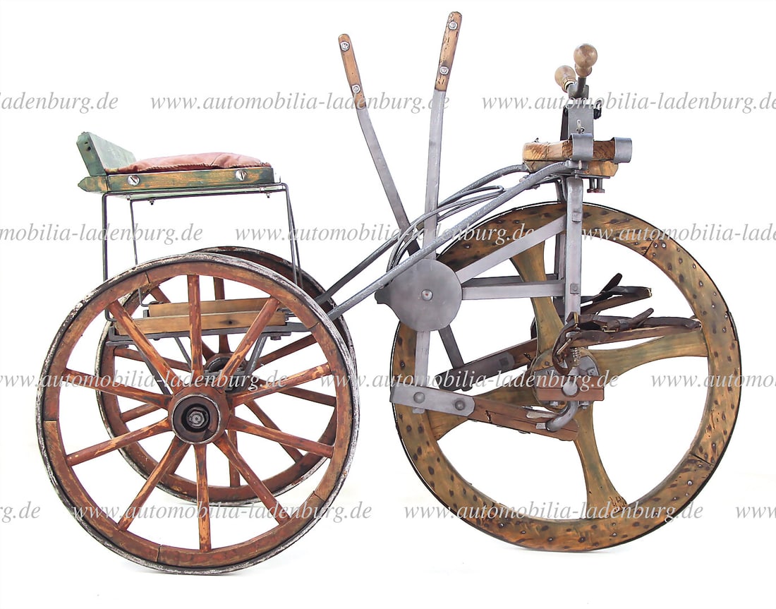 1900, tricycle with lever drive through the arms to the front wheel, steering with feet and arms,: 1900, tricycle with lever drive through the arms to the front wheel, steering with feet and arms, wrought-iron frame, wooden spoke wheels with iron tires, front wheel with four spokes and coachman's s