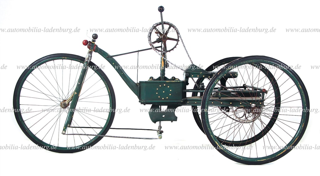 1900, wooden tricycle with drive by the arms via block chain to the rear axle, steering by the feet, (1 of 2)
