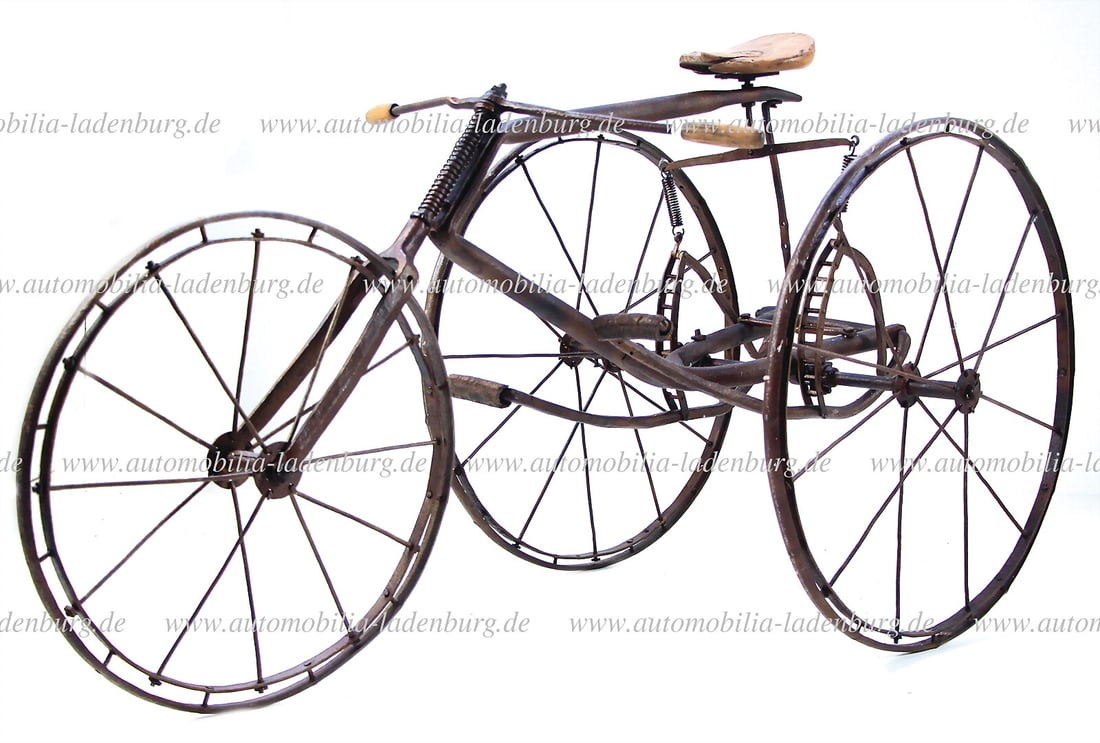 1900, iron tricycle with wrought-iron frame, iron rims, pedal drive with spring return and wooden (1 of 1)