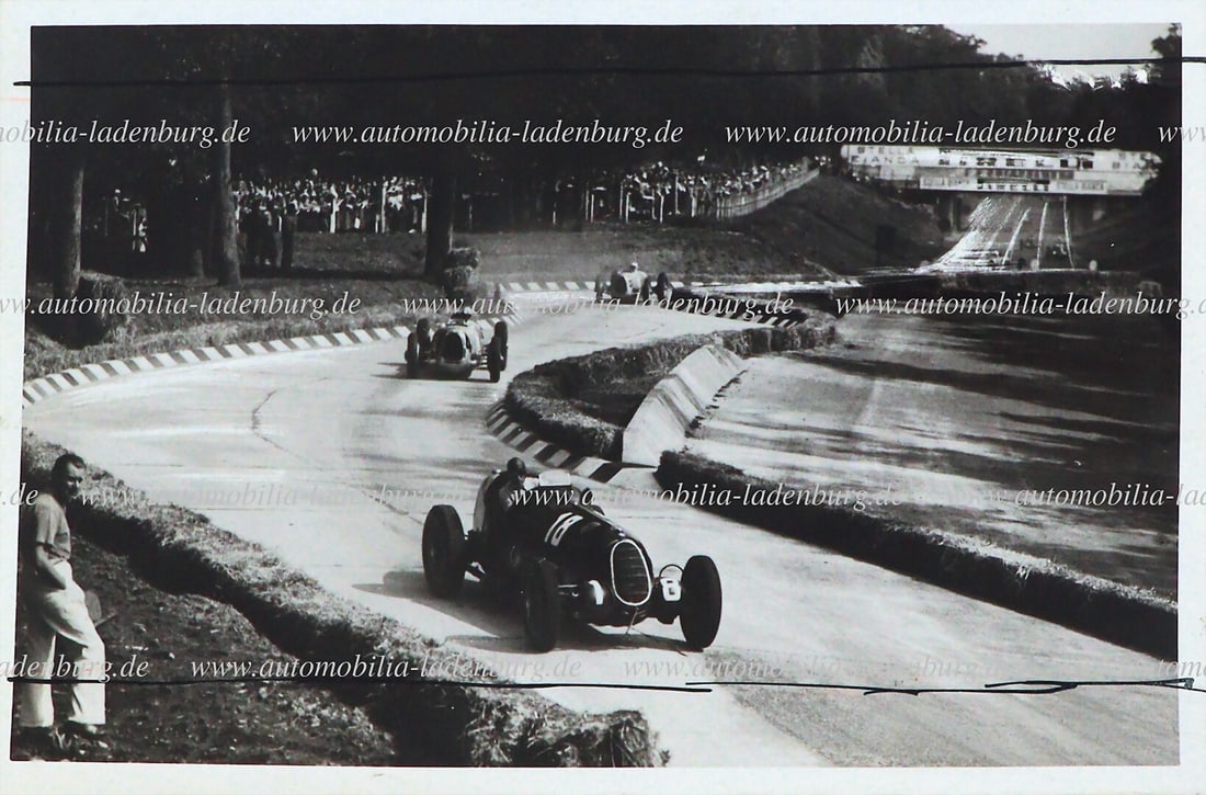 FERRARI Original b/w photograph of Tazio Nuvolari on Alfa Romeo 12C-36 (Scuderia Ferrari), 1936: FERRARI Original b/w photograph of Tazio Nuvolari on Alfa Romeo 12C-36 (Scuderia Ferrari), 1936 Italian Grand Prix, 13x18cm with markings German Description FERRARI Original s/w Aufnahme Tazio Nuvolar