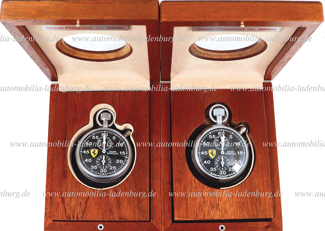 FERRARI Mixed lot of 2x stopwatch Ferrari "Girard Perregaux", limited (No. 182 & 215), in wooden: FERRARI Mixed lot of 2x stopwatch Ferrari "Girard Perregaux", limited (No. 182 & 215), in wooden case with leather strap, in working order German Description FERRARI Konvolut 2x Stoppuhr Ferrari â