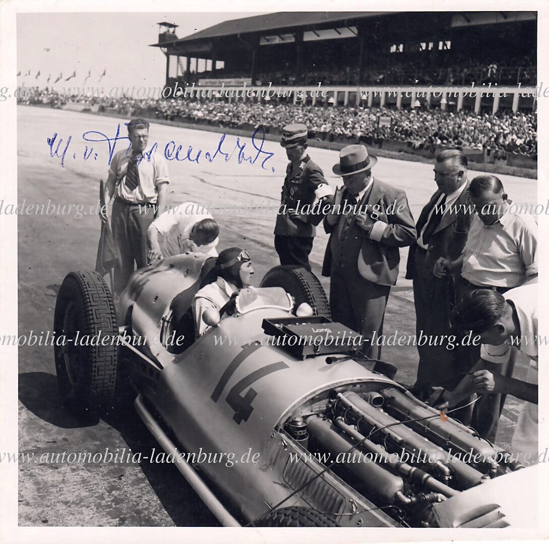 MERCEDES-BENZ hand-signed original b/w photo of Lang in the cockpit at the pit stop, signed by (1 of 2)