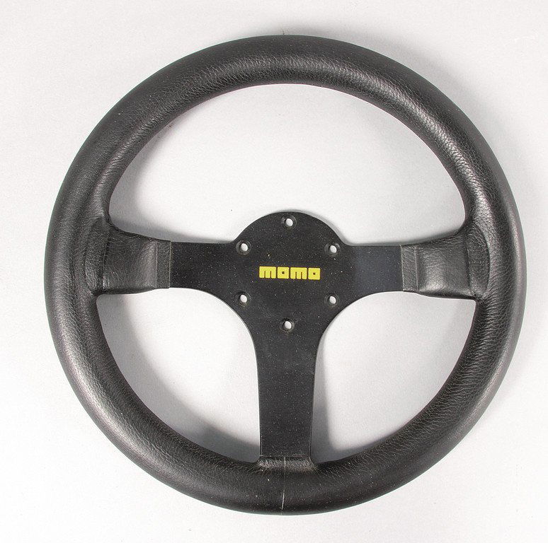 PORSCHE/MOMO Steering wheel, with a diameter of 23 cm,: PORSCHE/MOMO Steering wheel, with a diameter of 23 cm, was used in the Porsche 956 and 962, condition 1 German Description PORSCHE/MOMO Lenkrad, Durchmesser 23 cm, wurde für Porsche 956 und 962 benut