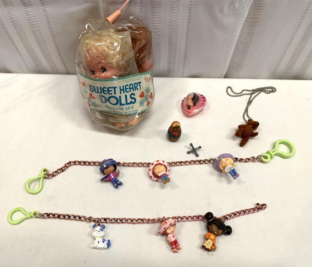 Childs Doll Lot: 2- Strawberry Shortcake Charm Bracelet/necklaces, Liddle Kiddles Pin, Mccrory Corp Sweet Heart Dolls, 1- Nesting Doll, Bear Necklace